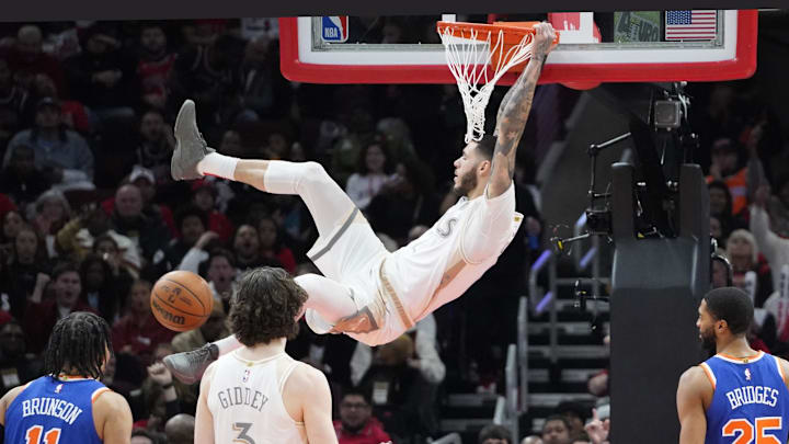 Jan 4, 2025; Chicago, Illinois, USA; Chicago Bulls guard Lonzo Ball (2) dunks the ball against the New York Knicks during the second half at United Center. Mandatory Credit: David Banks-Imagn Images