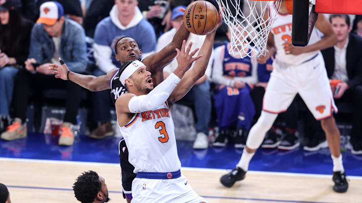 Jan 25, 2025; New York, New York, USA;  New York Knicks guard Josh Hart (3) drives to the basket against Sacramento Kings guard De'Aaron Fox (5) in the first quarter at Madison Square Garden. Mandatory Credit: Wendell Cruz-Imagn Images
