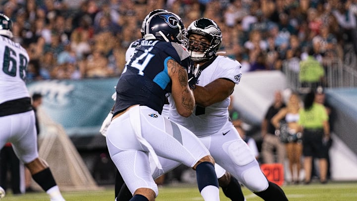 Former Philadelphia Eagles offensive tackle Andre Dillard (77) blocks Tennessee Titans outside linebacker Kamalei Correa (44). Former Philadelphia Eagles offensive tackle Andre Dillard (77) blocks Tennessee Titans outside linebacker Kamalei Correa (44).