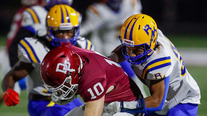 Milwaukee Rufus King High School's Bennett Words (33) tackles De Pere High School's Caden Schampers (10) during a WIAA Division 1 Level One playoff game on Friday, October 25, 2024, at De Pere High School in De Pere, Wis. De Pere won the game, 45-3.
Tork Mason/USA TODAY NETWORK-Wisconsin