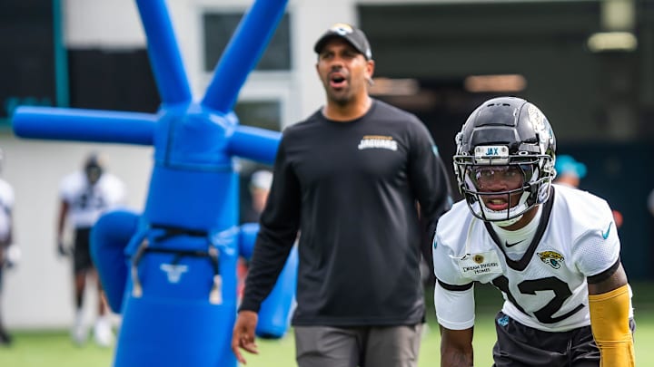 Jacksonville Jaguars defensive backs coach Anthony Perkins barks out orders as Jacksonville Jaguars wide receiver Travis Hunter (12) prepares to run a drill during the Jacksonville Jaguars’ mandatory minicamp Tuesday June 10, 2025 at the Miller Electric Center in Jacksonville, Fla. [Doug Engle/Florida Times-Union]