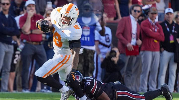 Oct 24, 2026; Columbia, South Carolina, USA; South Carolina Gamecocks defensive back Peyton Williams (31) dives for Tennessee Volunteers running back DeSean Bishop (18) during the first half at Williams-Brice Stadium. Mandatory Credit: Jim Dedmon-Imagn Images Oct 24, 2026; Columbia, South Carolina, USA; South Carolina Gamecocks defensive back Peyton Williams (31) dives for Tennessee Volunteers running back DeSean Bishop (18) during the first half at Williams-Brice Stadium. Mandatory Credit: Jim Dedmon-Imagn Images