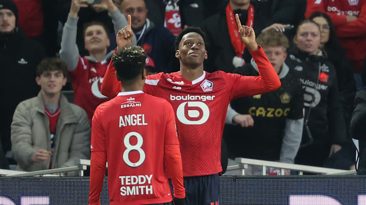 Angel Gomes and Jonathan David celebrate together for Lille