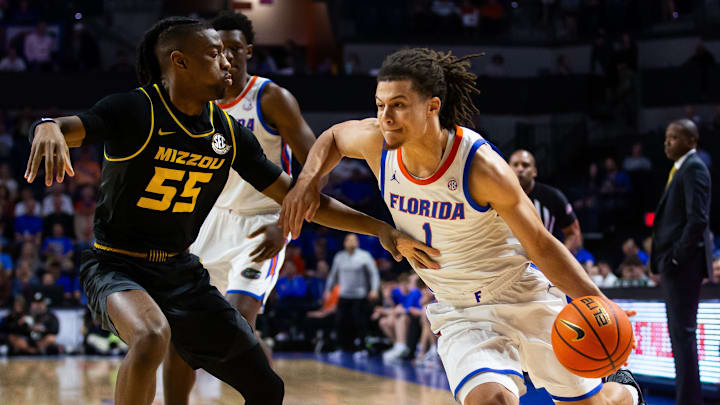 Florida Gators guard Walter Clayton Jr. (1) dribbles during the first half. The Florida men   s