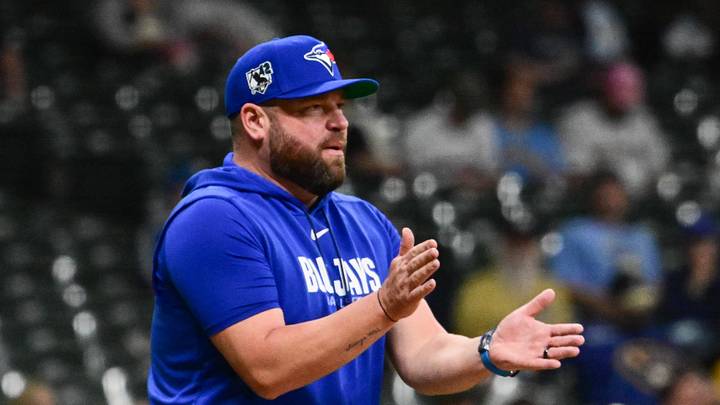 Toronto Blue Jays manager John Schneider makes a pitching change. Toronto Blue Jays manager John Schneider makes a pitching change.