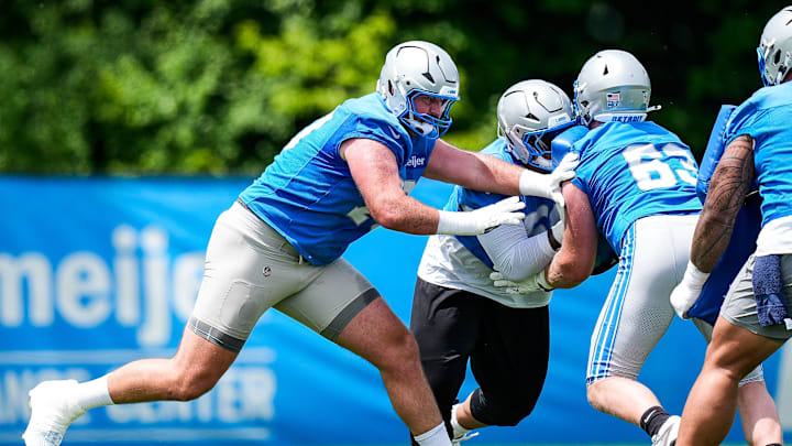 Detroit Lions offensive tackle Dan Skipper (70), center, practices during OTA at Meijer Performance Center in Allen Park on Friday, May 30, 2025.