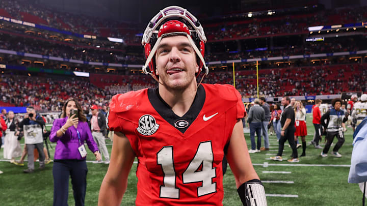 Nov 28, 2025; Atlanta, Georgia, USA; Georgia Bulldogs quarterback Gunner Stockton (14) celebrates after a victory over the Georgia Tech Yellow Jackets at Mercedes-Benz Stadium. Mandatory Credit: Brett Davis-Imagn Images
