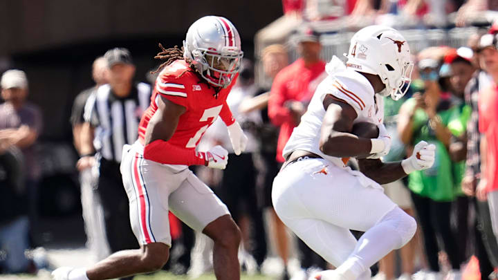 Ohio State Buckeyes cornerback Jermaine Mathews Jr. (7) pursues Texas Longhorns running back CJ Baxter (4) during the NCAA football game at Ohio Stadium on Aug. 30, 2025. Ohio State Buckeyes cornerback Jermaine Mathews Jr. (7) pursues Texas Longhorns running back CJ Baxter (4) during the NCAA football game at Ohio Stadium on Aug. 30, 2025.