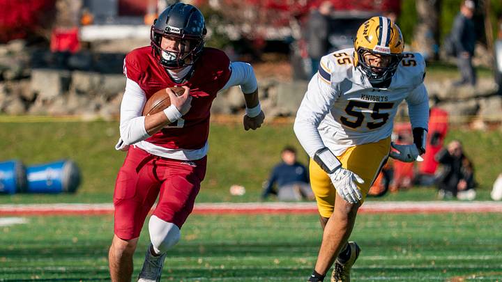 Quarterback Peter Bourque slips away from Knights defender Xzavier Chafin for a big run. Quarterback Peter Bourque slips away from Knights defender Xzavier Chafin for a big run.