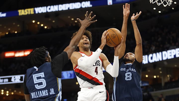 Mar 1, 2024; Memphis, Tennessee, USA; Portland Trail Blazers guard Matisse Thybulle (4) drives to the basket between Memphis Grizzlies guard Vince Williams Jr. (5) and Memphis Grizzlies forward Ziaire Williams (8) during the first half at FedExForum. Mandatory Credit: Petre Thomas-Imagn Images Mar 1, 2024; Memphis, Tennessee, USA; Portland Trail Blazers guard Matisse Thybulle (4) drives to the basket between Memphis Grizzlies guard Vince Williams Jr. (5) and Memphis Grizzlies forward Ziaire Williams (8) during the first half at FedExForum. Mandatory Credit: Petre Thomas-Imagn Images