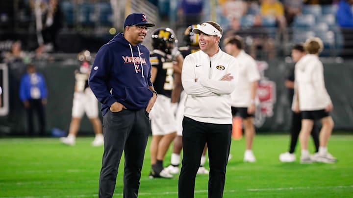 Dec 27, 2025; Jacksonville, FL, USA; Missouri Tigers head coach Eli Drinkwitz chats with Virginia Cavaliers head coach Tony Elliott before the Gator Bowl at EverBank Stadium. Mandatory Credit: Travis Register-Imagn Images Dec 27, 2025; Jacksonville, FL, USA; Missouri Tigers head coach Eli Drinkwitz chats with Virginia Cavaliers head coach Tony Elliott before the Gator Bowl at EverBank Stadium. Mandatory Credit: Travis Register-Imagn Images
