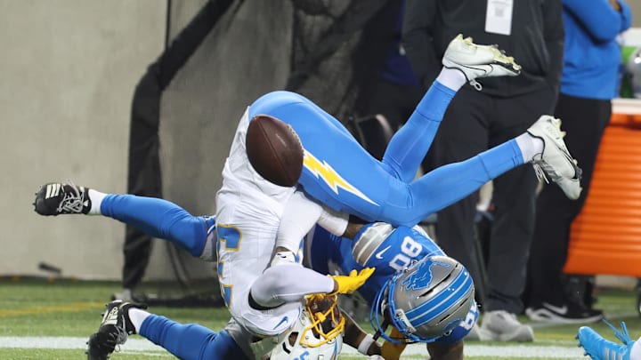 Jul 31, 2025; Canton, Ohio, USA; Los Angeles Chargers cornerback Eric Rogers (39) breaks up a pass intended for Detroit Lions wide receiver Jakobie Keeney-James (80) during the second half at Tom Benson Hall of Fame Stadium. Mandatory Credit: Charles LeClaire-Imagn Images Jul 31, 2025; Canton, Ohio, USA; Los Angeles Chargers cornerback Eric Rogers (39) breaks up a pass intended for Detroit Lions wide receiver Jakobie Keeney-James (80) during the second half at Tom Benson Hall of Fame Stadium. Mandatory Credit: Charles LeClaire-Imagn Images