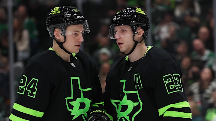 Dec 31, 2024; Dallas, Texas, USA; Dallas Stars defenseman Esa Lindell (23) talks to center Roope Hintz (24) iduring the second period against the Buffalo Sabres at American Airlines Center. Mandatory Credit: Tim Heitman-Imagn Images