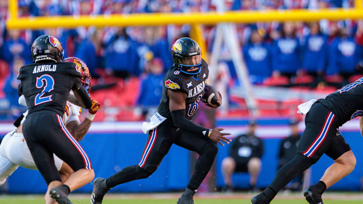 Nov 9, 2024; Kansas City, Missouri, USA; Kansas Jayhawks quarterback Jalon Daniels (6) runs the ball during the second quarter against the Iowa State Cyclones at GEHA Field at Arrowhead Stadium. Mandatory Credit: William Purnell-Imagn Images
