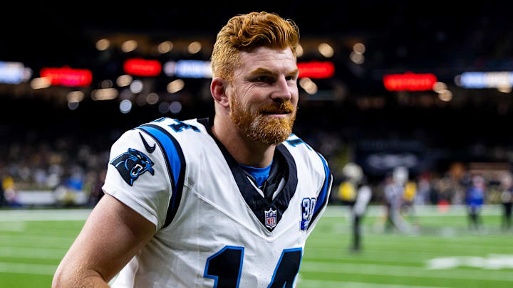 Sep 8, 2024; New Orleans, Louisiana, USA;  Carolina Panthers quarterback Andy Dalton (14) walks off the field against the New Orleans Saints during the pregame at Caesars Superdome. Mandatory Credit: Stephen Lew-Imagn Images