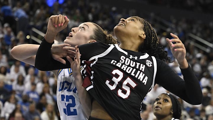 Nov 24, 2024; Los Angeles, California, USA; South Carolina Gamecocks center Sakima Walker (35) and UCLA Bruins forward Angela Dugalic (32) jockey for rebounding position during the fourth quarter at Pauley Pavilion presented by Wescom. Mandatory Credit: Robert Hanashiro-Imagn Images