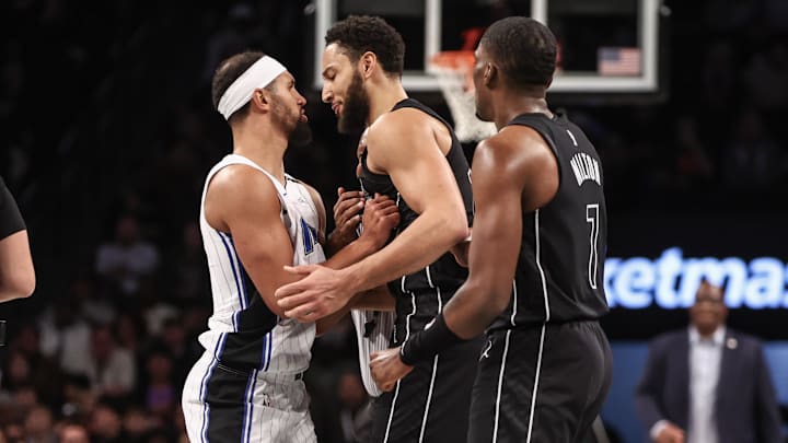 Orlando Magic guard Jalen Suggs (4) and Brooklyn Nets guard Ben Simmons (10) have an exchange in the second quarter at Barclays Center.