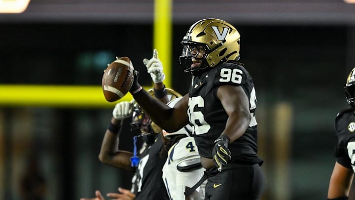 Aug 30, 2025; Nashville, Tennessee, USA; Vanderbilt Commodores defensive lineman Khordae Sydnor (96) celebrates the fumble recovery against the Charleston Southern Buccaneers during the first half at FirstBank Stadium. Mandatory Credit: Steve Roberts-Imagn Images Aug 30, 2025; Nashville, Tennessee, USA; Vanderbilt Commodores defensive lineman Khordae Sydnor (96) celebrates the fumble recovery against the Charleston Southern Buccaneers during the first half at FirstBank Stadium. Mandatory Credit: Steve Roberts-Imagn Images
