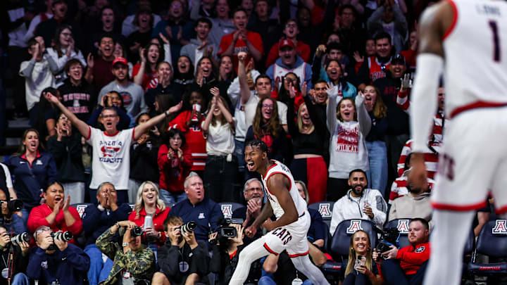 Nov 4, 2024; Tucson, Arizona, USA;  Arizona Wildcats guard Jaden Bradley (0) and Zona Zoo fans celebrate during the first half against Canisius Golden Griffins at McKale Center. Mandatory Credit: Aryanna Frank-Imagn Images