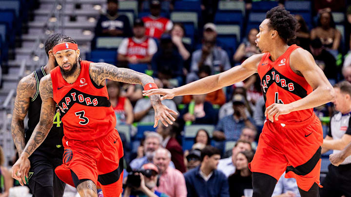 Mar 11, 2026; New Orleans, Louisiana, USA;  Toronto Raptors forward/guard Scottie Barnes (4) and forward Brandon Ingram (3) slap hands after a play against the New Orleans Pelicans during the first half at Smoothie King Center. Mandatory Credit: Stephen Lew-Imagn Images