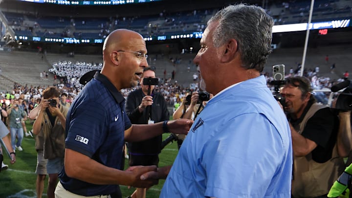 Penn State Nittany Lions head coach James Franklin (left) shakes hands with Villanova Wildcats head coach Mark Ferrante (right) following the end of the game at Beaver Stadium.