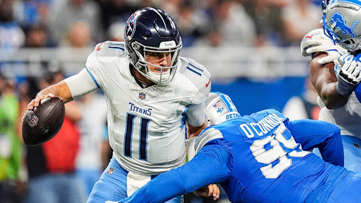 Detroit Lions defensive end Pat O'Connor (95) tackles Tennessee Titans quarterback Mason Rudolph (11) during the second half at Ford Field in Detroit on Sunday, Oct. 27, 2024.