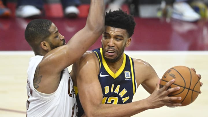Apr 13, 2025; Cleveland, Ohio, USA; Cleveland Cavaliers center Tristan Thompson (13) defends Indiana Pacers center Tony Bradley (13) in the third quarter at Rocket Arena. Mandatory Credit: David Richard-Imagn Images