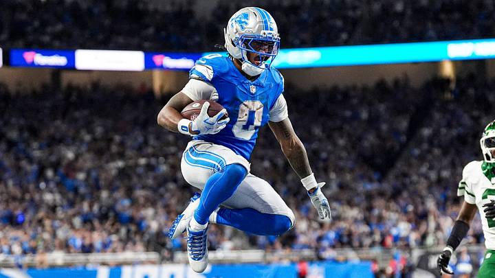 Detroit Lions running back Jahmyr Gibbs (0) leaps into the end zone for a touchdown against New York Jets during the second half at Ford Field in Detroit on Sunday, Sept. 27, 2026. Detroit Lions running back Jahmyr Gibbs (0) leaps into the end zone for a touchdown against New York Jets during the second half at Ford Field in Detroit on Sunday, Sept. 27, 2026.