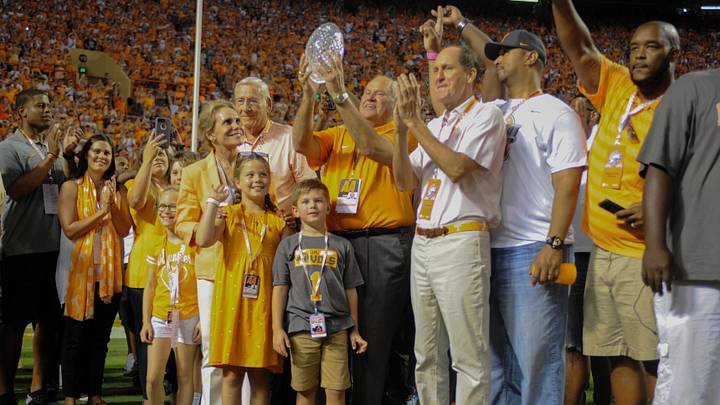 Sep 22, 2018; Knoxville, TN, USA; Tennessee Volunteers athletic director Phillip Fulmer holds the Amway Coaches Trophy during a celebration honoring the 1998 national championship game during the first half of the game against the Florida Gators at Neyland Stadium. Mandatory Credit: Randy Sartin-USA TODAY Sports Sep 22, 2018; Knoxville, TN, USA; Tennessee Volunteers athletic director Phillip Fulmer holds the Amway Coaches Trophy during a celebration honoring the 1998 national championship game during the first half of the game against the Florida Gators at Neyland Stadium. Mandatory Credit: Randy Sartin-USA TODAY Sports