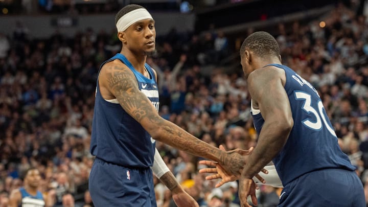 Dec 13, 2024; Minneapolis, Minnesota, USA; Minnesota Timberwolves forward Jaden McDaniels (3) congratulates forward Julius Randle (30) on a basket against the Los Angeles Lakers in the fourth quarter at Target Center. Mandatory Credit: Matt Blewett-Imagn Images