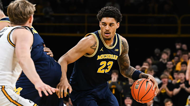 Michigan Wolverines forward Yaxel Lendeborg controls the ball against the Iowa Hawkeyes