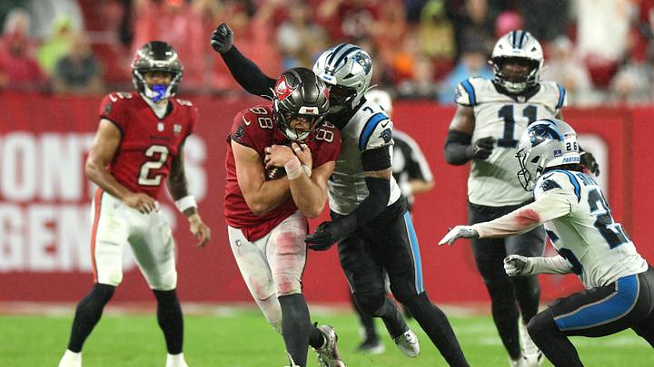 Jan 3, 2026; Tampa, Florida, USA; Tampa Bay Buccaneers tight end Cade Otton (88) runs against Carolina Panthers safety Tre'von Moehrig (7) in the second half at Raymond James Stadium. Mandatory Credit: Nathan Ray Seebeck-Imagn Images