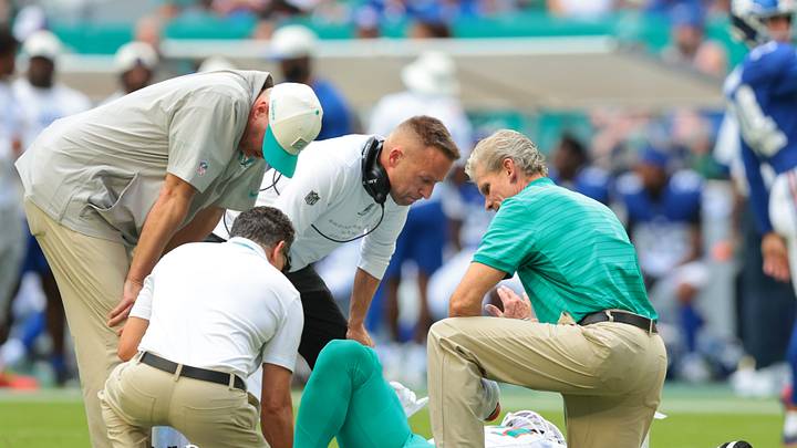 Aug 22, 2026; Miami Gardens, Florida, USA; Miami Dolphins head coach Jeff Hafley checks on linebacker Trey Moore (17) after an apparent leg injury against the New York Giants during the first half at Hard Rock Stadium. Mandatory Credit: Sam Navarro-Imagn Images Aug 22, 2026; Miami Gardens, Florida, USA; Miami Dolphins head coach Jeff Hafley checks on linebacker Trey Moore (17) after an apparent leg injury against the New York Giants during the first half at Hard Rock Stadium. Mandatory Credit: Sam Navarro-Imagn Images