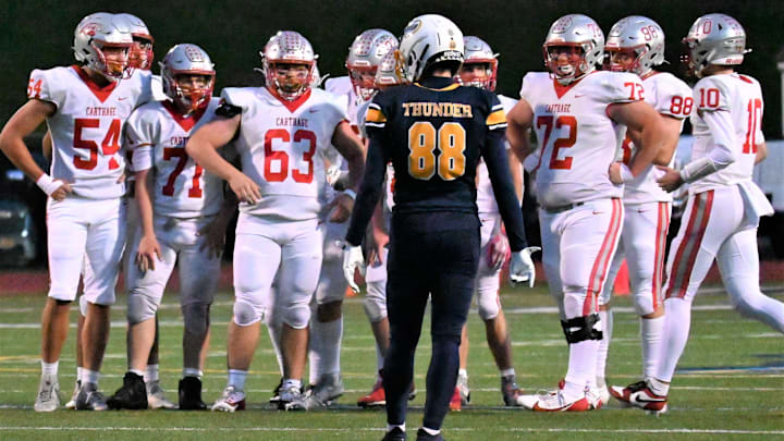 The Carthage varsity football team, pictured here competing against Central Valley Academy in 2024, has reclassified from Class B to A for the 2025 season.