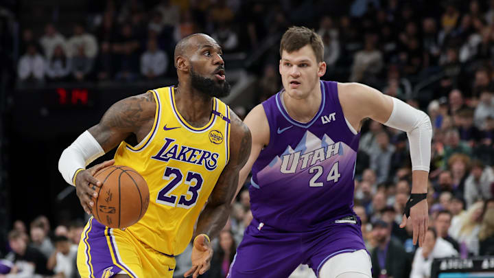 Feb 12, 2025; Salt Lake City, Utah, USA; Los Angeles Lakers forward LeBron James (23) dribbles past Utah Jazz center Walker Kessler (24) during the first quarter at Delta Center. Mandatory Credit: Chris Nicoll-Imagn Images Feb 12, 2025; Salt Lake City, Utah, USA; Los Angeles Lakers forward LeBron James (23) dribbles past Utah Jazz center Walker Kessler (24) during the first quarter at Delta Center. Mandatory Credit: Chris Nicoll-Imagn Images