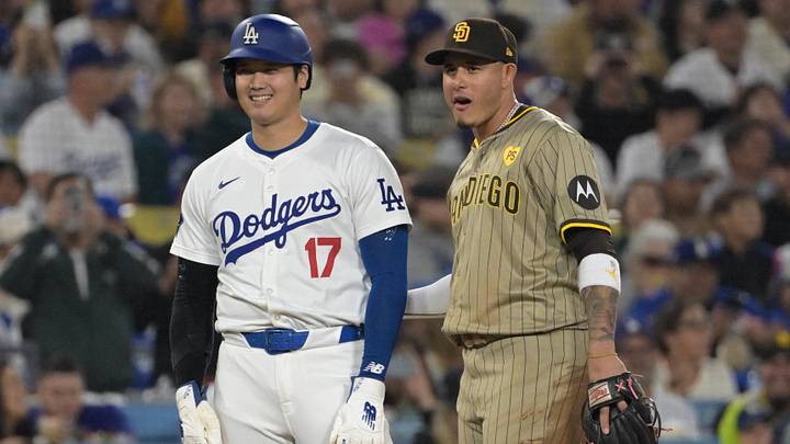 Sep 26, 2024; Los Angeles, California, USA;  Los Angeles Dodgers designated hitter Shohei Ohtani (17) and San Diego Padres third baseman Manny Machado (13) talk on the base during the seventh inning at Dodger Stadium. Mandatory Credit: Jayne Kamin-Oncea-Imagn Images