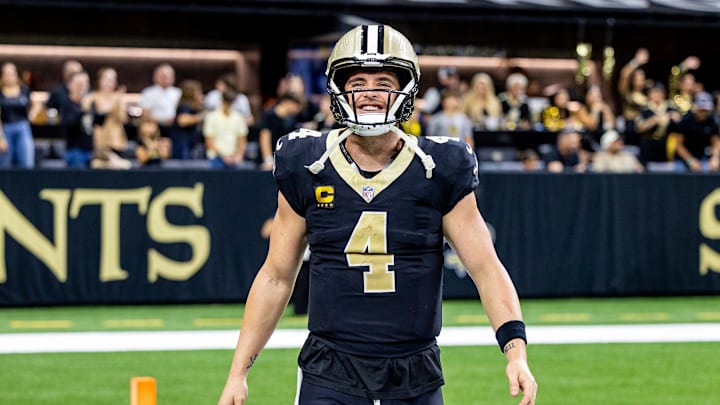 Nov 17, 2024; New Orleans, Louisiana, USA; New Orleans Saints quarterback Derek Carr (4) reacts after tight end Taysom Hill (not pictured) scores a touchdown against the Cleveland Browns during the second half at Caesars Superdome. Mandatory Credit: Stephen Lew-Imagn Images Nov 17, 2024; New Orleans, Louisiana, USA; New Orleans Saints quarterback Derek Carr (4) reacts after tight end Taysom Hill (not pictured) scores a touchdown against the Cleveland Browns during the second half at Caesars Superdome. Mandatory Credit: Stephen Lew-Imagn Images