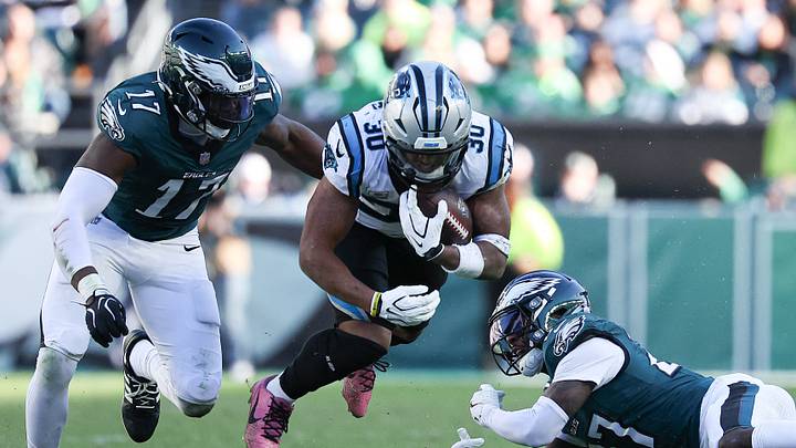 Oct 18, 2026; Philadelphia, Pennsylvania, USA; Carolina Panthers running back Chuba Hubbard (30) runs with the ball between Philadelphia Eagles cornerback Quinyon Mitchell (27) and linebacker Arnold Ebiketie (17) during the fourth quarter at Lincoln Financial Field. Mandatory Credit: Bill Streicher-Imagn Images Oct 18, 2026; Philadelphia, Pennsylvania, USA; Carolina Panthers running back Chuba Hubbard (30) runs with the ball between Philadelphia Eagles cornerback Quinyon Mitchell (27) and linebacker Arnold Ebiketie (17) during the fourth quarter at Lincoln Financial Field. Mandatory Credit: Bill Streicher-Imagn Images