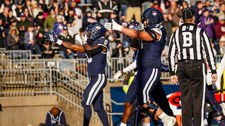Nov 15, 2025; East Hartford, Connecticut, USA; UConn Huskies running back Cam Edwards (0) reacts after scoring against the Air Force Falcons in the second half at Pratt & Whitney Stadium at Rentschler Field. Mandatory Credit: David Butler II-Imagn Images
