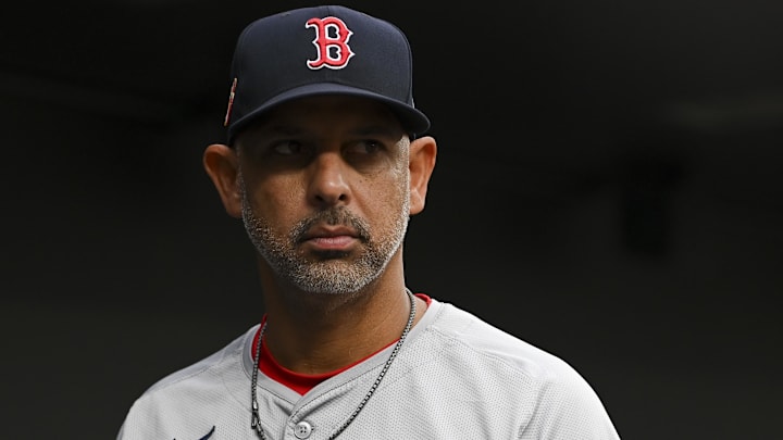 Aug 16, 2024; Baltimore, Maryland, USA; Boston Red Sox manager Alex Cora (13) stands in the dugout during the first inning of the game against the Baltimore Orioles  at Oriole Park at Camden Yards. Mandatory Credit: Tommy Gilligan-Imagn Images