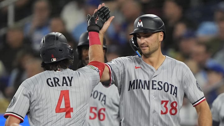 Apr 12, 2026; Toronto, Ontario, CAN; Minnesota Twins right fielder Matt Wallner (38) congratulates third baseman Tristan Gray (4) after his three run home run against the Toronto Blue Jays during the second inning at Rogers Centre. Mandatory Credit: John E. Sokolowski-Imagn Images