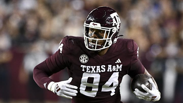 Nov 16, 2024; College Station, Texas, USA; Texas A&M Aggies tight end Tre Watson (84) runs the ball during the first quarter against the New Mexico State Aggies at Kyle Field. Mandatory Credit: Maria Lysaker-Imagn Images 