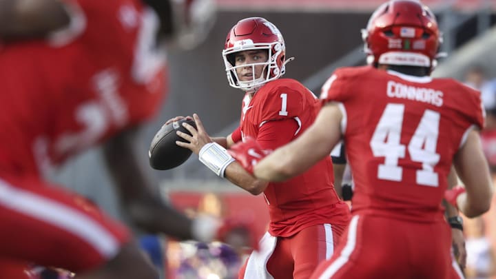 Nov 22, 2025; Houston, Texas, USA; Houston Cougars quarterback Conner Weigman (1) looks for an open receiver during the second quarter against the TCU Horned Frogs at TDECU Stadium. Mandatory Credit: Troy Taormina-Imagn Images