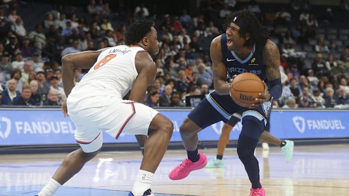 Apr 1, 2026; Memphis, Tennessee, USA; Memphis Grizzlies forward GG Jackson (45) handles the ball as New York Knicks forward OG Anunoby (8) defends during the fourth quarter at FedExForum. Mandatory Credit: Petre Thomas-Imagn Images