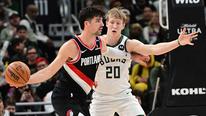 Jan 4, 2025; Milwaukee, Wisconsin, USA; Portland Trail Blazers forward Deni Avdija (8) looks to pass the ball against Milwaukee Bucks guard AJ Green (20) in the fourth quarter at Fiserv Forum. Mandatory Credit: Benny Sieu-Imagn Images