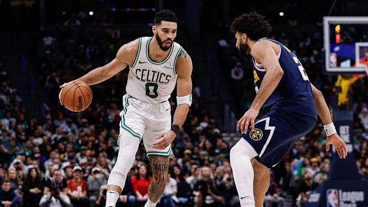 Jan 7, 2025; Denver, Colorado, USA; Boston Celtics forward Jayson Tatum (0) controls the ball as Denver Nuggets guard Jamal Murray (27) guards in the fourth quarter at Ball Arena. Mandatory Credit: Isaiah J. Downing-Imagn Images Jan 7, 2025; Denver, Colorado, USA; Boston Celtics forward Jayson Tatum (0) controls the ball as Denver Nuggets guard Jamal Murray (27) guards in the fourth quarter at Ball Arena. Mandatory Credit: Isaiah J. Downing-Imagn Images