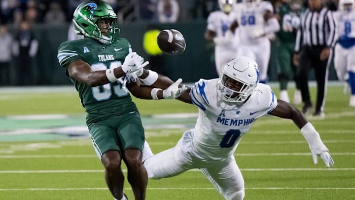Nov 28, 2024; New Orleans, Louisiana, USA; Memphis Tigers defensive back Kourtlan Marsh (0) stops Tulane Green Wave wide receiver Bryce Bohanon (83) from grabbing a reception during the fourth quarter at Yulman Stadium. Mandatory Credit: Matthew Hinton-Imagn Images Nov 28, 2024; New Orleans, Louisiana, USA; Memphis Tigers defensive back Kourtlan Marsh (0) stops Tulane Green Wave wide receiver Bryce Bohanon (83) from grabbing a reception during the fourth quarter at Yulman Stadium. Mandatory Credit: Matthew Hinton-Imagn Images