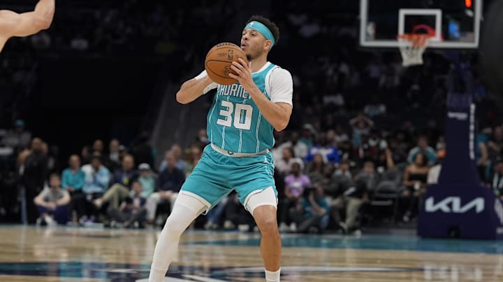 Apr 4, 2025; Charlotte, North Carolina, USA; Charlotte Hornets guard Seth Curry (30) pulls up to shoot a three against the Sacramento Kings during the second half at Spectrum Center. Mandatory Credit: Jim Dedmon-Imagn Images