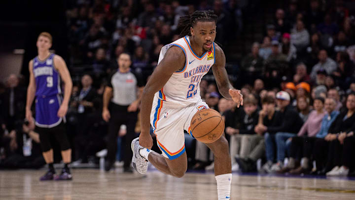 Nov 25, 2024; Sacramento, California, USA; Oklahoma City Thunder guard Cason Wallace (22) pushes the ball up the court during the third quarter against the Sacramento Kings at Golden 1 Center. Mandatory Credit: Ed Szczepanski-Imagn Images