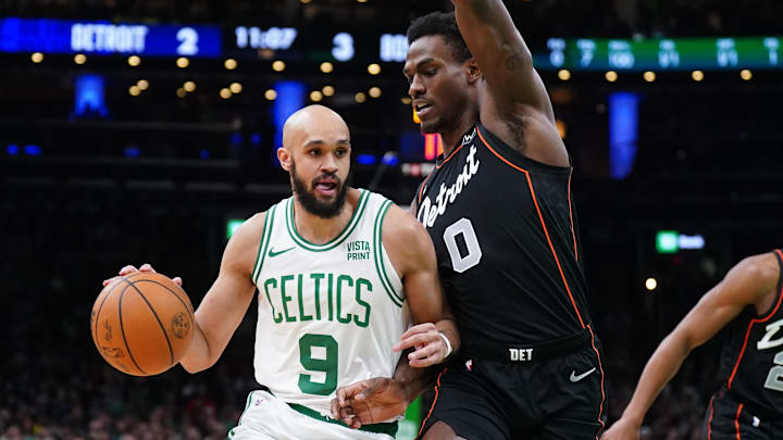 Mar 18, 2024; Boston, Massachusetts, USA; Boston Celtics guard Derrick White (9) drives the ball against Jalen Duren